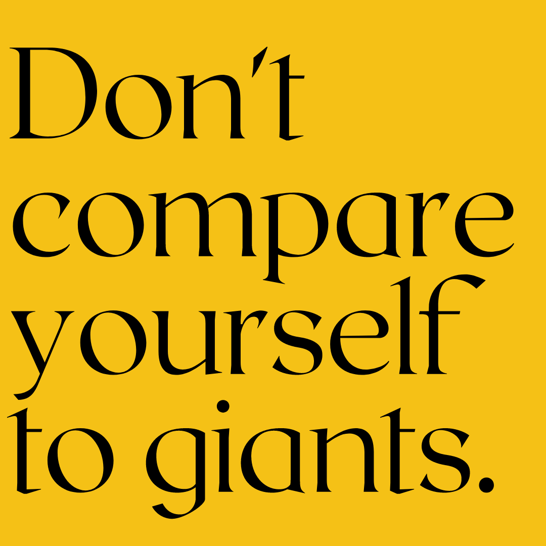 Black text on a teal background reads, "Don't compare yourself to giants."